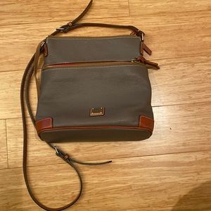 Adjustable strap. Strap drop length 25". Lined.  H 10.25" x W 4" x L 10.5"